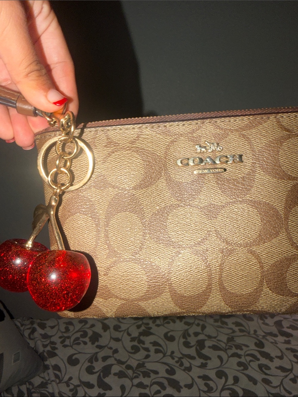 Coach Brown Signature Canvas Wristlet with Red Cherry Charm